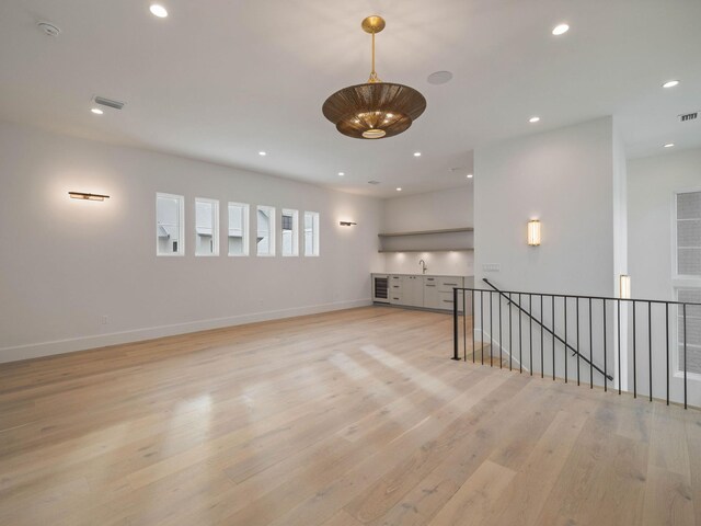 unfurnished living room featuring light hardwood / wood-style floors