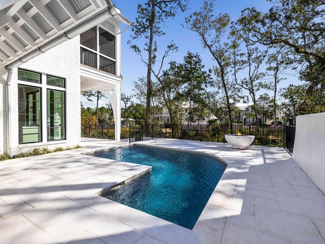 view of swimming pool with a patio