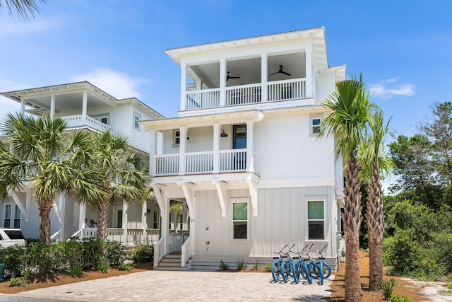 beach home with ceiling fan and a balcony