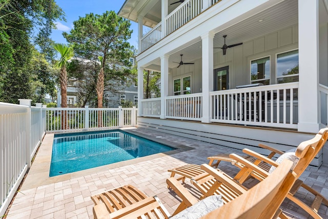 view of pool featuring a patio and ceiling fan