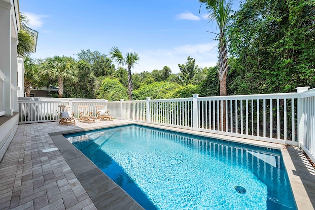 view of swimming pool featuring a patio