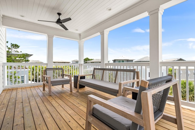 wooden terrace featuring an outdoor hangout area and ceiling fan