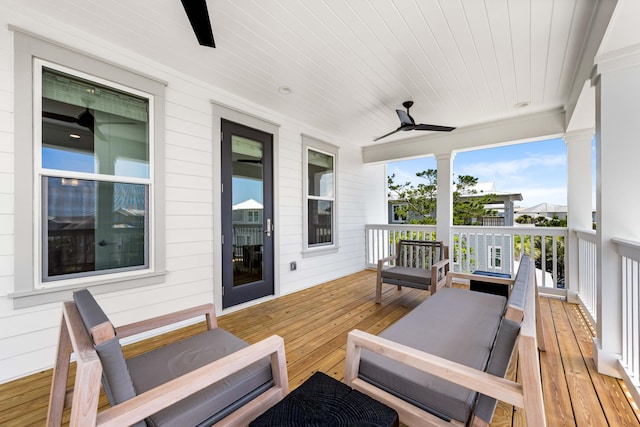 deck with ceiling fan and an outdoor hangout area