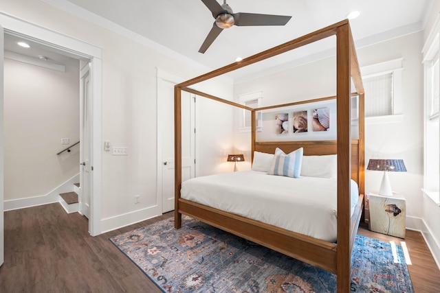 bedroom featuring ceiling fan and dark hardwood / wood-style flooring