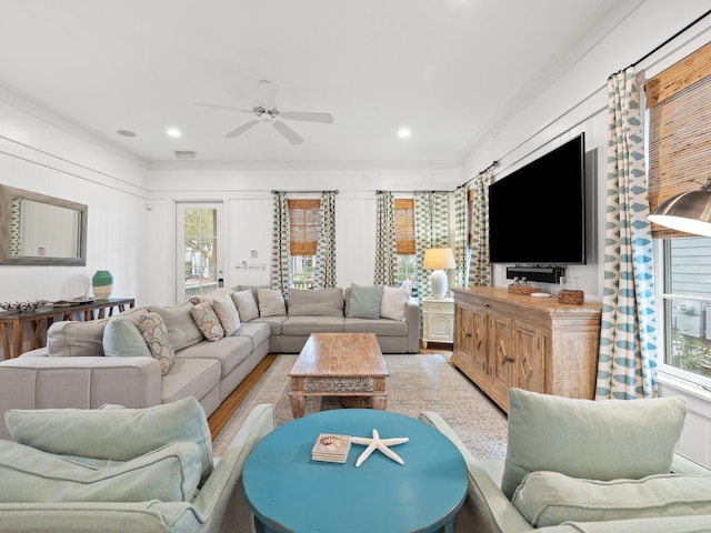 living room featuring light wood-type flooring, a ceiling fan, and recessed lighting