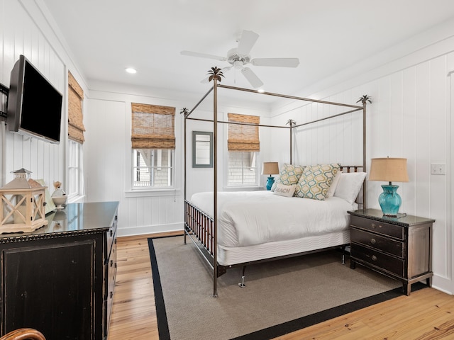 bedroom with light wood-style floors and ceiling fan