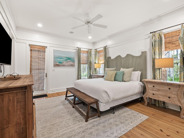 bedroom with access to outside, light wood finished floors, a ceiling fan, and crown molding