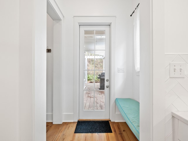 entryway with wood finished floors