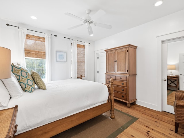 bedroom with baseboards, ceiling fan, light wood finished floors, and recessed lighting