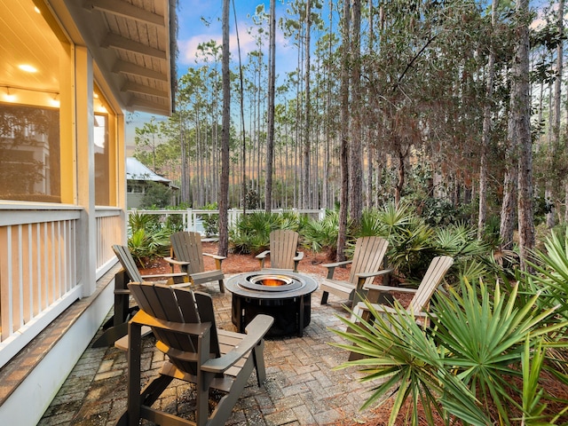 view of patio / terrace with an outdoor fire pit