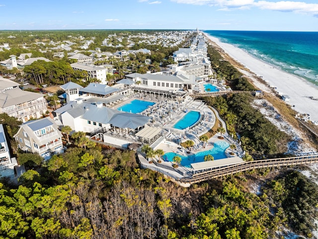 drone / aerial view with a water view and a beach view