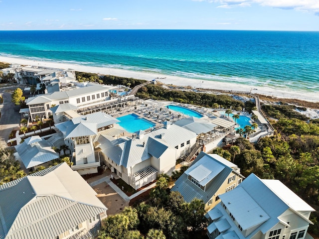 birds eye view of property with a view of the beach and a water view