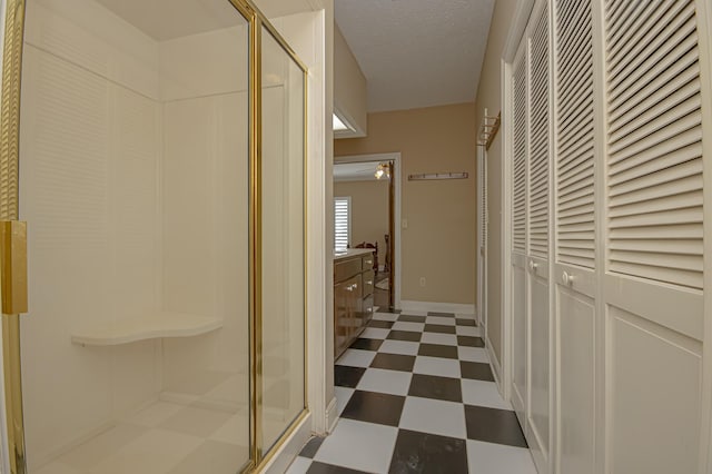 hallway with a textured ceiling