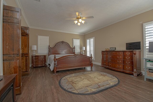 bedroom featuring ceiling fan, hardwood / wood-style floors, crown molding, and a textured ceiling