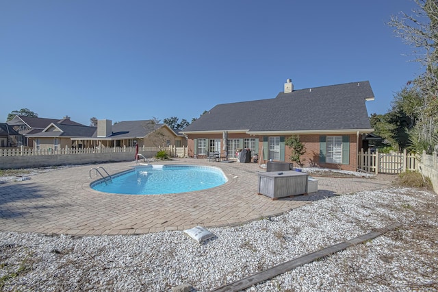 view of swimming pool featuring a patio