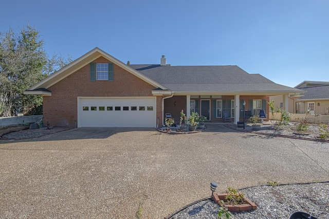 view of front of house featuring covered porch and a garage