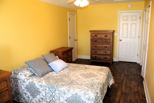 bedroom with ceiling fan and dark hardwood / wood-style flooring