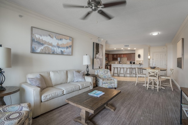 10 Harbor Blvd Unit W528, Destin, FL 32541 - living area featuring ceiling fan, crown molding, and a textured ceiling
