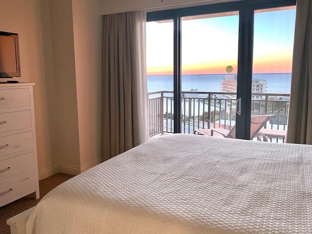 10 Harbor Blvd Unit W528, Destin, FL 32541 - carpeted bedroom featuring a water view, access to exterior, and multiple windows
