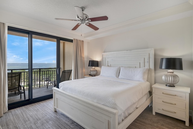 10 Harbor Blvd Unit W528, Destin, FL 32541 - bedroom featuring access to outside, dark carpet, a water view, ornamental molding, and ceiling fan