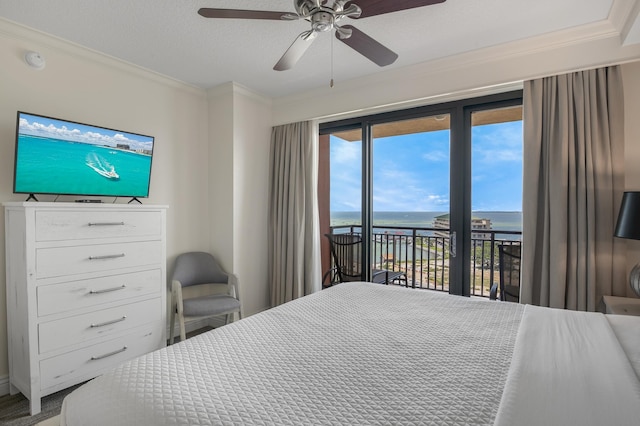 10 Harbor Blvd Unit W528, Destin, FL 32541 - bedroom featuring access to exterior, a water view, ornamental molding, and a ceiling fan