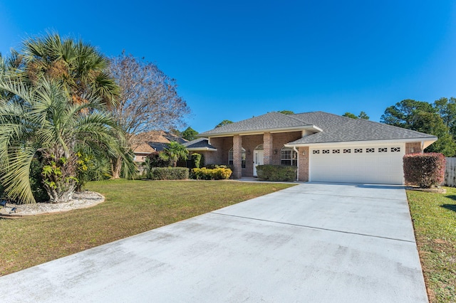 view of front of house with a garage and a front yard