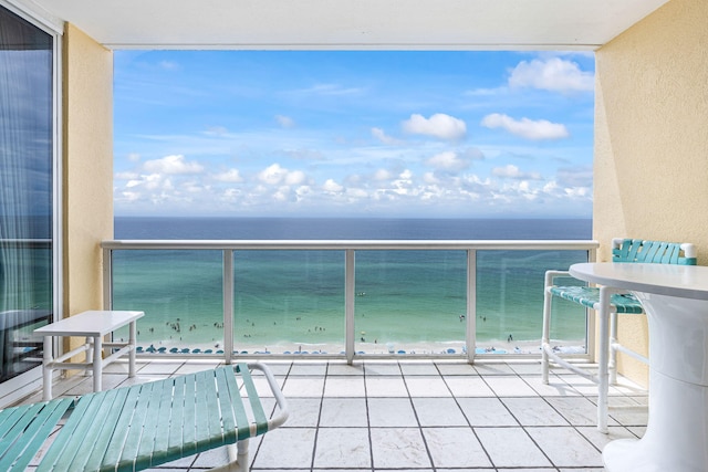 balcony with a view of the beach and a water view