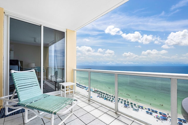 balcony with a beach view and a water view