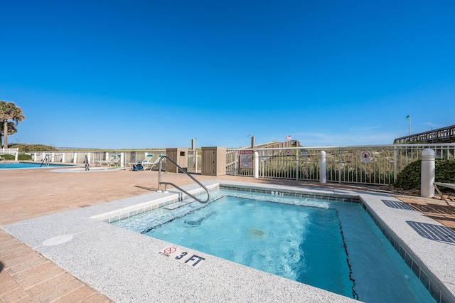 community pool with fence