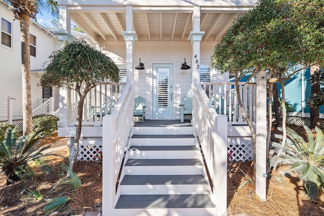 property entrance with covered porch