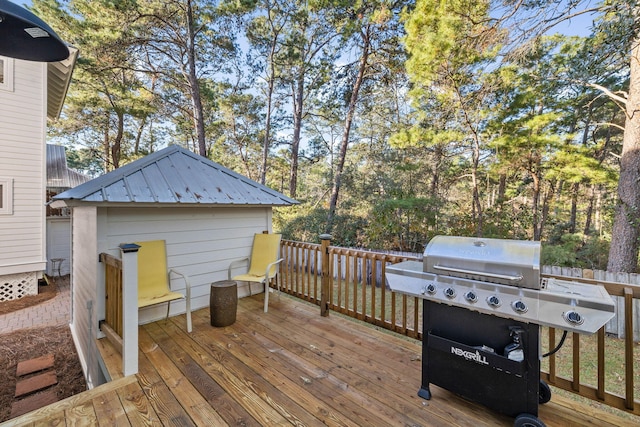 wooden deck featuring area for grilling