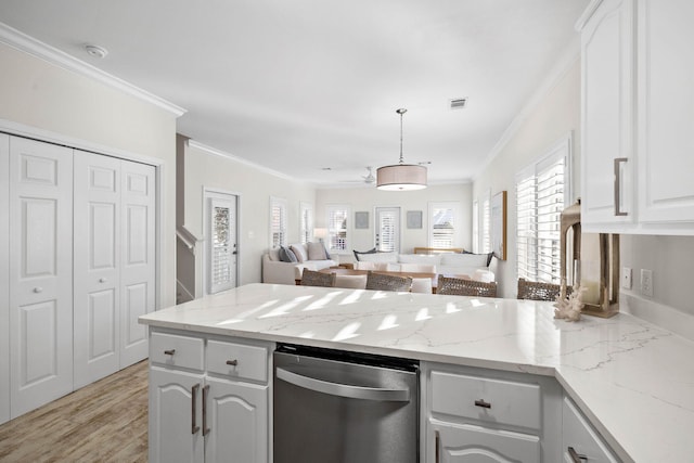 kitchen featuring white cabinetry, light wood-type flooring, decorative light fixtures, and ornamental molding