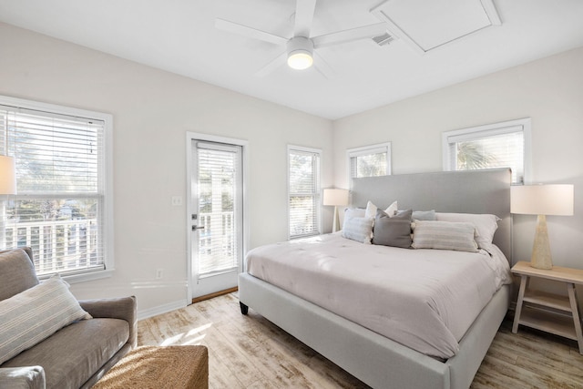 bedroom with light wood-type flooring, access to outside, and ceiling fan