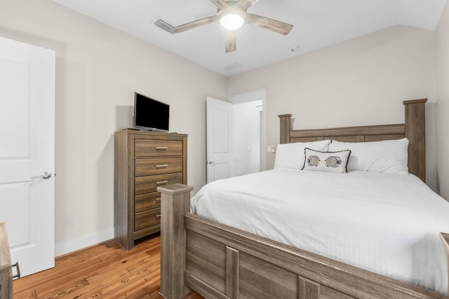 bedroom featuring vaulted ceiling, light hardwood / wood-style flooring, and ceiling fan