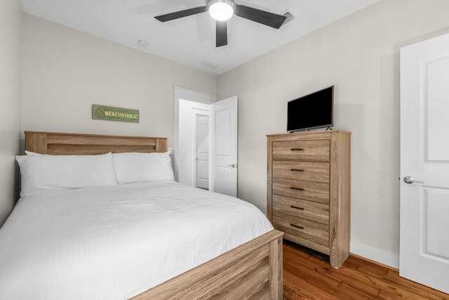 bedroom featuring ceiling fan and wood-type flooring