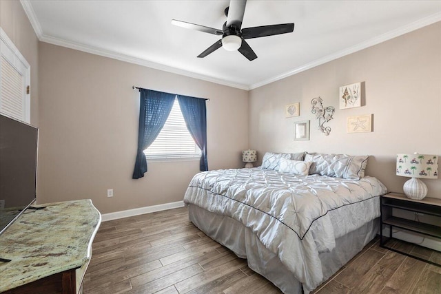 bedroom featuring hardwood / wood-style floors, ceiling fan, and ornamental molding