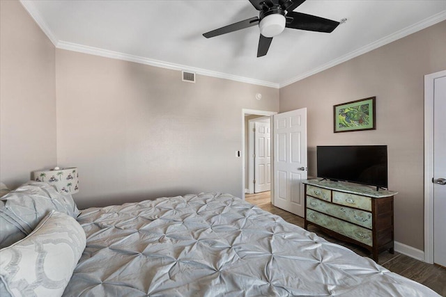 bedroom with ceiling fan, light hardwood / wood-style floors, and crown molding