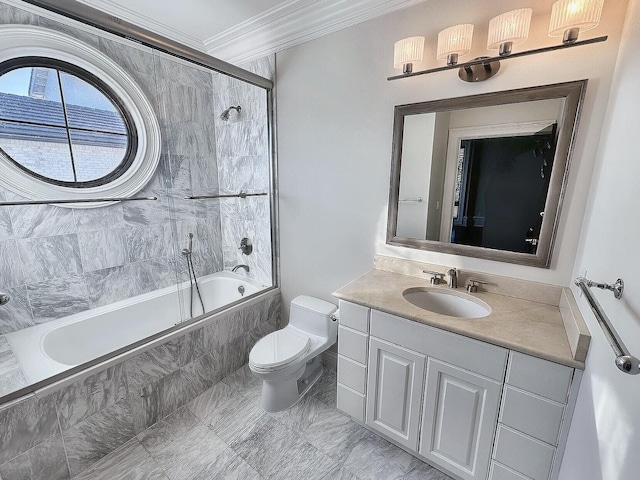 full bathroom featuring vanity, tiled shower / bath combo, ornamental molding, and toilet