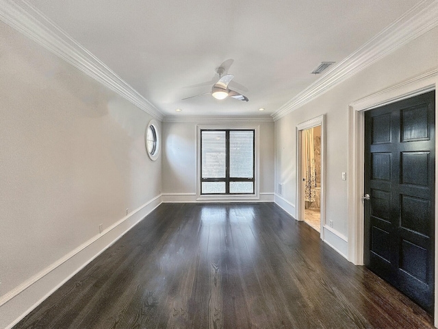 unfurnished room with crown molding, ceiling fan, and dark hardwood / wood-style flooring