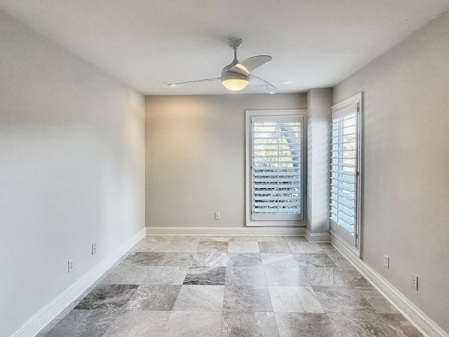 spare room featuring ceiling fan