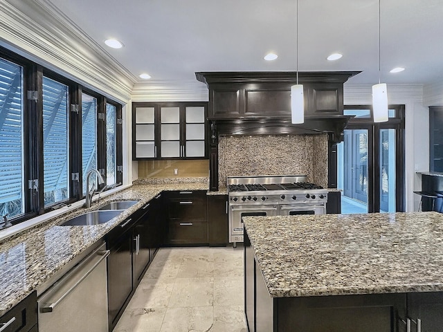 kitchen featuring pendant lighting, sink, dark stone countertops, and appliances with stainless steel finishes