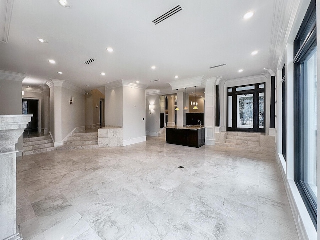 unfurnished living room featuring crown molding