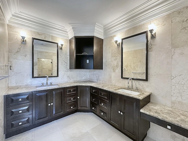 bathroom with vanity, ornamental molding, and tile walls