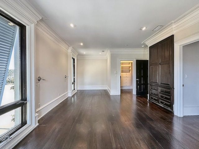 interior space featuring ornamental molding and dark hardwood / wood-style flooring