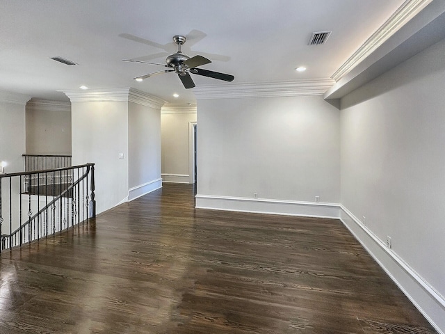 spare room featuring ornamental molding, ceiling fan, and dark hardwood / wood-style flooring