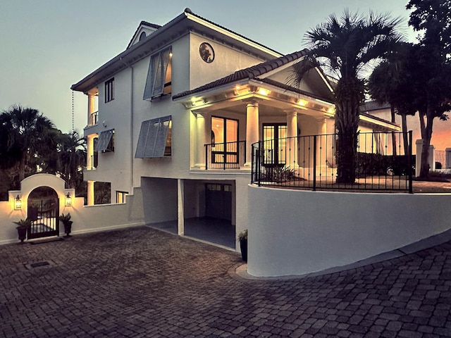 view of front of house with a balcony