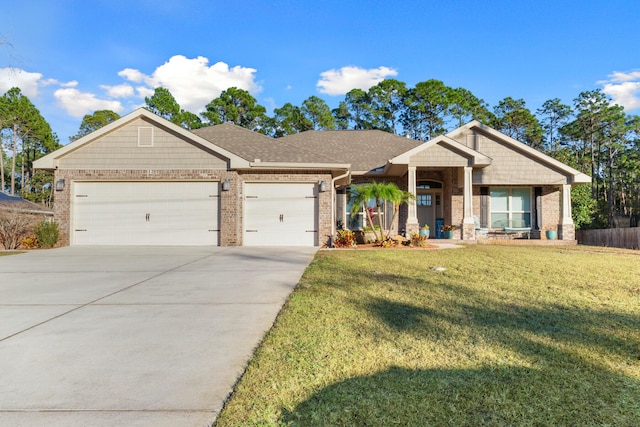 view of front of property featuring a garage and a front yard