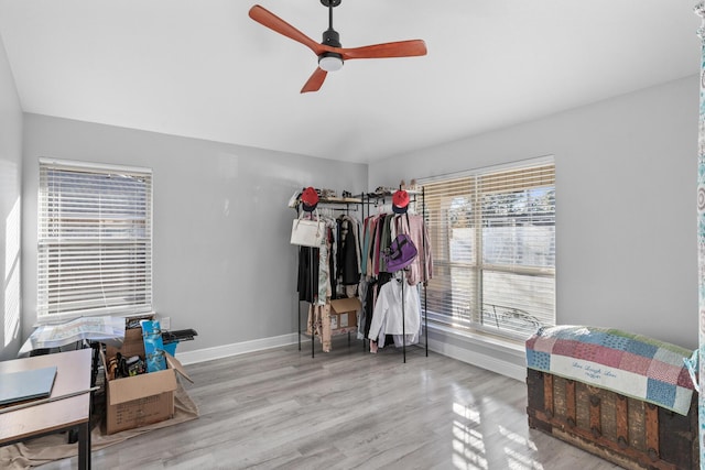 bedroom with ceiling fan and light hardwood / wood-style flooring