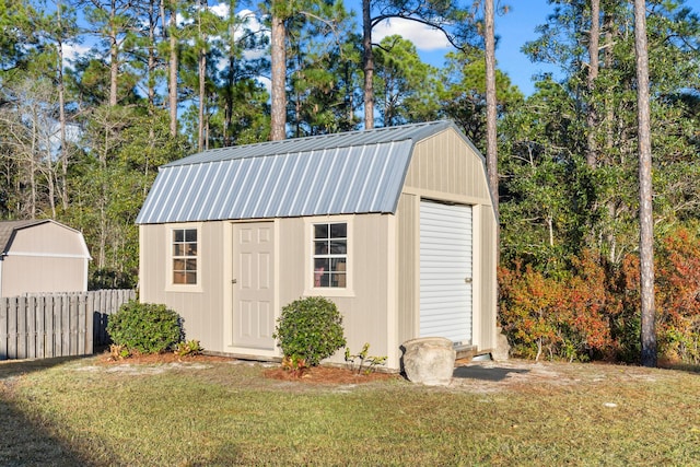 view of outdoor structure with a lawn