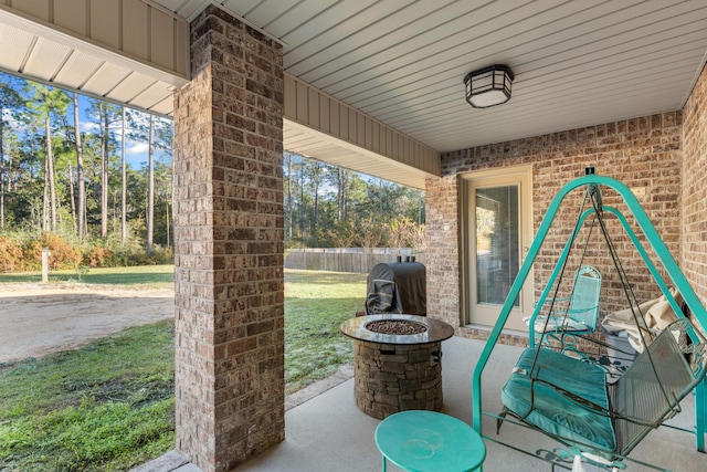 view of patio / terrace with a grill and a fire pit